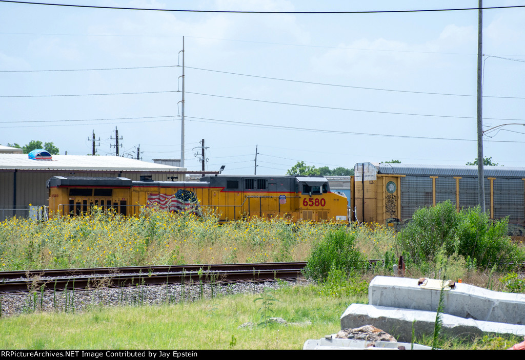 UP 6580 shoves on the rear of a manifest at Tower 26